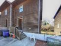 Exterior of the apartment building showcasing wood siding and a small entryway at 813 Alexander St, Statesville, NC 28677