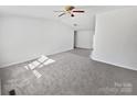 Bright living room with grey carpeting and natural light at 153 Pattys Pl, Stony Point, NC 28678