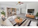 Virtually staged living room featuring a neutral color palette and built-in shelving at 153 Pattys Pl, Stony Point, NC 28678