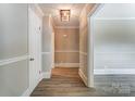 Bright hallway with neutral walls, wood floors and white doors at 170 Sherwood Cir, Rock Hill, SC 29730