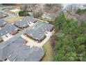 Aerial view of the property in a neighborhood, near a lake at 2008 Surefire Ct, Denver, NC 28037