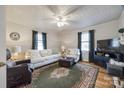 Bright living room featuring hardwood floors and decorative ceiling at 30 Hunter St, York, SC 29745