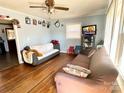 Inviting living room with hardwood floors, light blue walls, and natural light, creating a cozy and airy space at 3520 Carlyle Dr, Charlotte, NC 28208