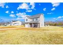 Charming two-story home with vinyl siding, attached garage, and landscaped yard under a sunny sky at 425 Webb Rd, Shelby, NC 28152