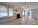 Inviting living room with fireplace, windows, and neutral walls at 636 Hillcrest Dr, Shelby, NC 28150