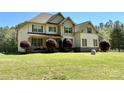 Inviting two-story home with a well-maintained lawn and a welcoming front porch at 712 Kenway Loop, Mooresville, NC 28117