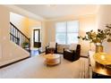 Inviting living room features hardwood floors, a bright window, and comfortable seating creating a cozy ambiance at 712 Kenway Loop, Mooresville, NC 28117