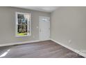 Bright entryway featuring wood-look floors, fresh paint and natural light at 7921 Fairmont Dr, Waxhaw, NC 28173