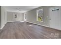 Spacious living room with durable floors, neutral paint, and bright, natural light at 7921 Fairmont Dr, Waxhaw, NC 28173