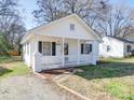 Cozy home with a covered porch, perfect for enjoying the outdoors at 1213 Cloninger Ave, Gastonia, NC 28052