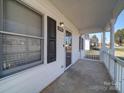 Inviting covered front porch, ideal for relaxing or entertaining guests at 1213 Cloninger Ave, Gastonia, NC 28052