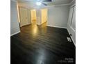 Spacious living room featuring new flooring, fresh paint, generous room dimensions, and contemporary finishes at 128 N Oak St, Salisbury, NC 28146