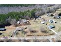 Overhead shot showing a house, outbuildings, yard, and neighboring properties at 1354 Mirror Lake Rd, Lincolnton, NC 28092