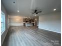 Expansive living room featuring hardwood floors, recessed lighting and an open floor plan concept at 160 Swann Rd # 6, Statesville, NC 28625
