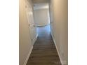 Bright hallway with light grey wood-look flooring at 1606 Lincoln Dr, Shelby, NC 28152