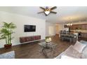 Open-concept living area adjacent to kitchen with wood floors and modern decor at 184 Flat Rock Dr, Denver, NC 28037