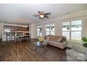 Bright living area featuring wood floors, a ceiling fan, and lots of natural light at 184 Flat Rock Dr, Denver, NC 28037