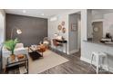 Stylishly decorated living room featuring hardwood floors, a cozy seating area, and a workspace at 2000 Patio Ct # 101, Charlotte, NC 28205