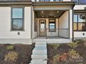 Inviting front porch with gray flooring and metal railing at 207 Halemarge Drive Dr, Belmont, NC 28012