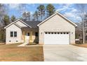 Charming single-Gathering home with a white brick exterior, attached two-car garage, and a well-maintained front yard at 2365 Kool Park Ne Rd, Hickory, NC 28601