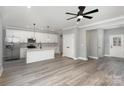 Bright and airy open-concept kitchen featuring stainless steel appliances, an island, and sleek, modern cabinetry at 2365 Kool Park Ne Rd, Hickory, NC 28601