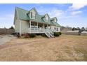 Charming two-story home with green metal roof and inviting front porch at 515 Brawley Rd, Cleveland, NC 27013