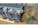 An aerial view shows the rooftop deck and modern design of this urban townhome at 7020 Loso Commons Way, Charlotte, NC 28217