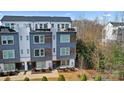 Modern townhome featuring a rooftop deck, and sleek exterior at 7020 Loso Commons Way, Charlotte, NC 28217