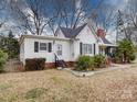 Charming single-story home with dark shutters, landscaped yard and sidewalk at 706 W 19Th Ave, Gastonia, NC 28052