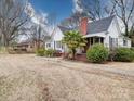 Charming single-story home with brick chimney and a manicured front yard at 706 W 19Th Ave, Gastonia, NC 28052