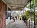 Cozy front porch with metal railing and stylish outdoor furniture at 706 W 19Th Ave, Gastonia, NC 28052