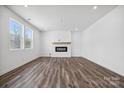 Bright living room featuring hardwood floors and a modern fireplace at 821 Hallman Branch Ln, Lincolnton, NC 28092