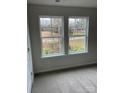 Bright bedroom with large windows offering a view of the backyard at 917 W Sumter St, Shelby, NC 28150