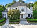 Two-story house with gray siding, gray roof, and landscaping at 10811 Old Tayport Pl, Charlotte, NC 28277