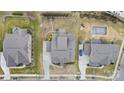 An aerial view showcases the home's layout, landscaping, and proximity to neighborhood amenities and other houses at 11223 Wescott Hill Dr, Huntersville, NC 28078