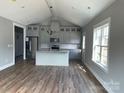 Open concept kitchen boasts modern cabinetry, granite countertops, and stainless steel appliances at 1526 W Horah St, Salisbury, NC 28144