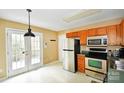 Kitchen with stainless steel appliances and access to deck at 234 Candle Nw Ct, Concord, NC 28027