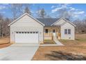 Charming, new construction, single-story home with white brick and a two-car garage at 2385 Kool Park Ne Rd # 2, Hickory, NC 28601
