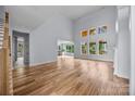 Spacious living room features soaring ceilings, fireplace, hardwood floors, and lots of natural light at 2418 Lexington Approach Dr, Charlotte, NC 28262