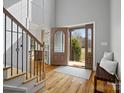 Inviting foyer featuring hardwood floors, staircase and a decorative front door at 2553 Cozy Cove Dr, York, SC 29745