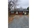Cozy single-story brick home with driveway and well-kept landscape at 32269 Pennington Rd, Albemarle, NC 28001