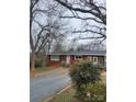 Charming single-story brick home featuring a driveway and well-kept front yard at 32269 Pennington Rd, Albemarle, NC 28001