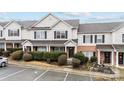 Charming townhouse with brick accents, landscaped front yard, black shutters and inviting front door at 3553 Calpella Ct, Charlotte, NC 28262