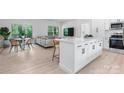 Bright and airy living space with modern kitchen island, dining area, and comfortable seating at 3722 Thompson St, Newton, NC 28658