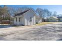 Cozy home showcasing a charming front porch with a fresh coat of light-gray paint at 528 6Th St, Chester, SC 29706
