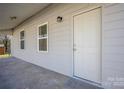 Inviting covered front porch with a modern front door and classic overhead lighting at 528 6Th St, Chester, SC 29706