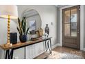 Hallway with a decorative table and a mirror at 5324 Stonewood Dr, Hickory, NC 28602