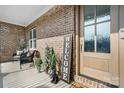 Inviting front porch with chairs, plants and a Welcome sign at 5324 Stonewood Dr, Hickory, NC 28602