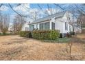 Charming exterior view of single Gathering home showing siding, roof, yard, and minimal landscaping at 63 3Rd Nw St, Concord, NC 28027