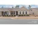 Charming home exterior with brick accents, neutral siding, and well-maintained landscaping at 8500 Union Central Ct, Waxhaw, NC 28173